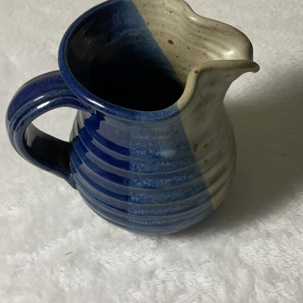Artistic Blue and Cream Ceramic Pitcher with Ribbed Design